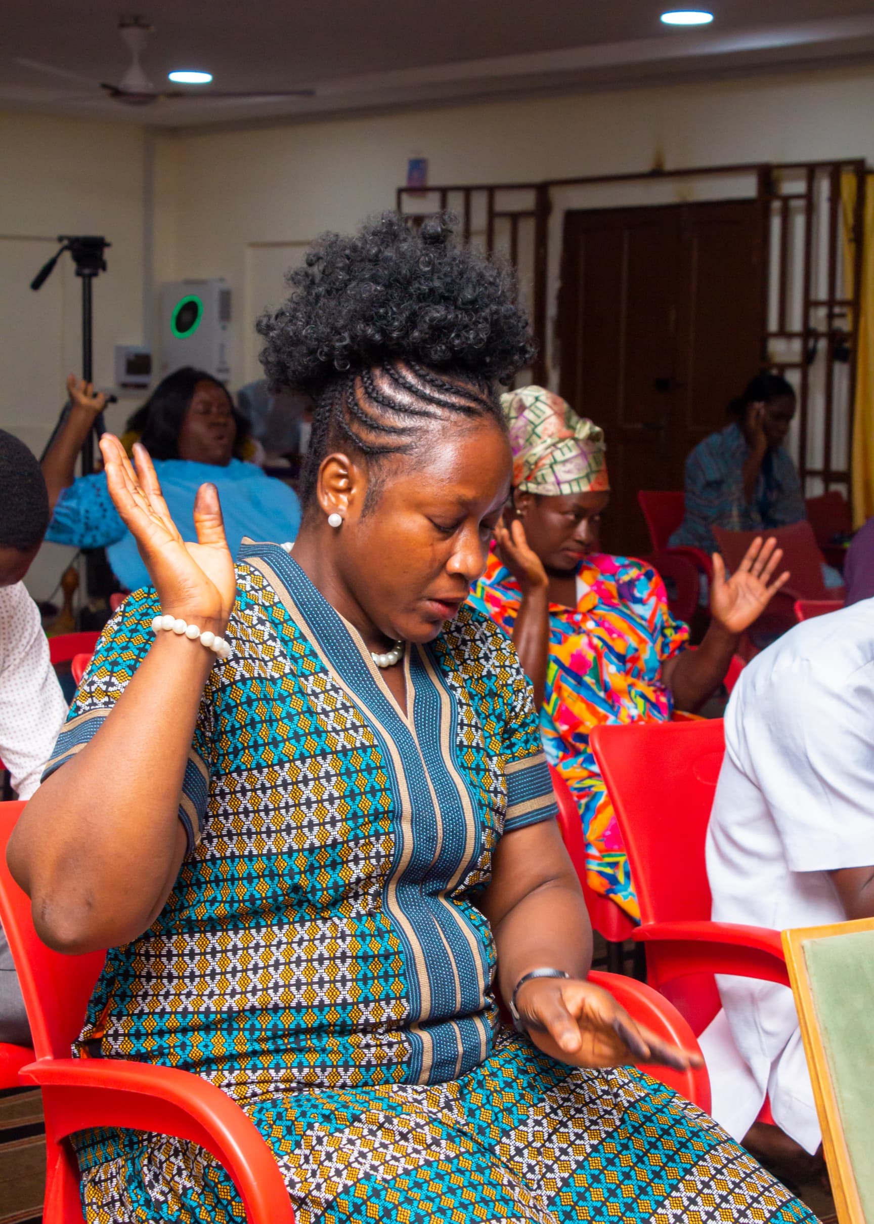 Woman praying during a worship service