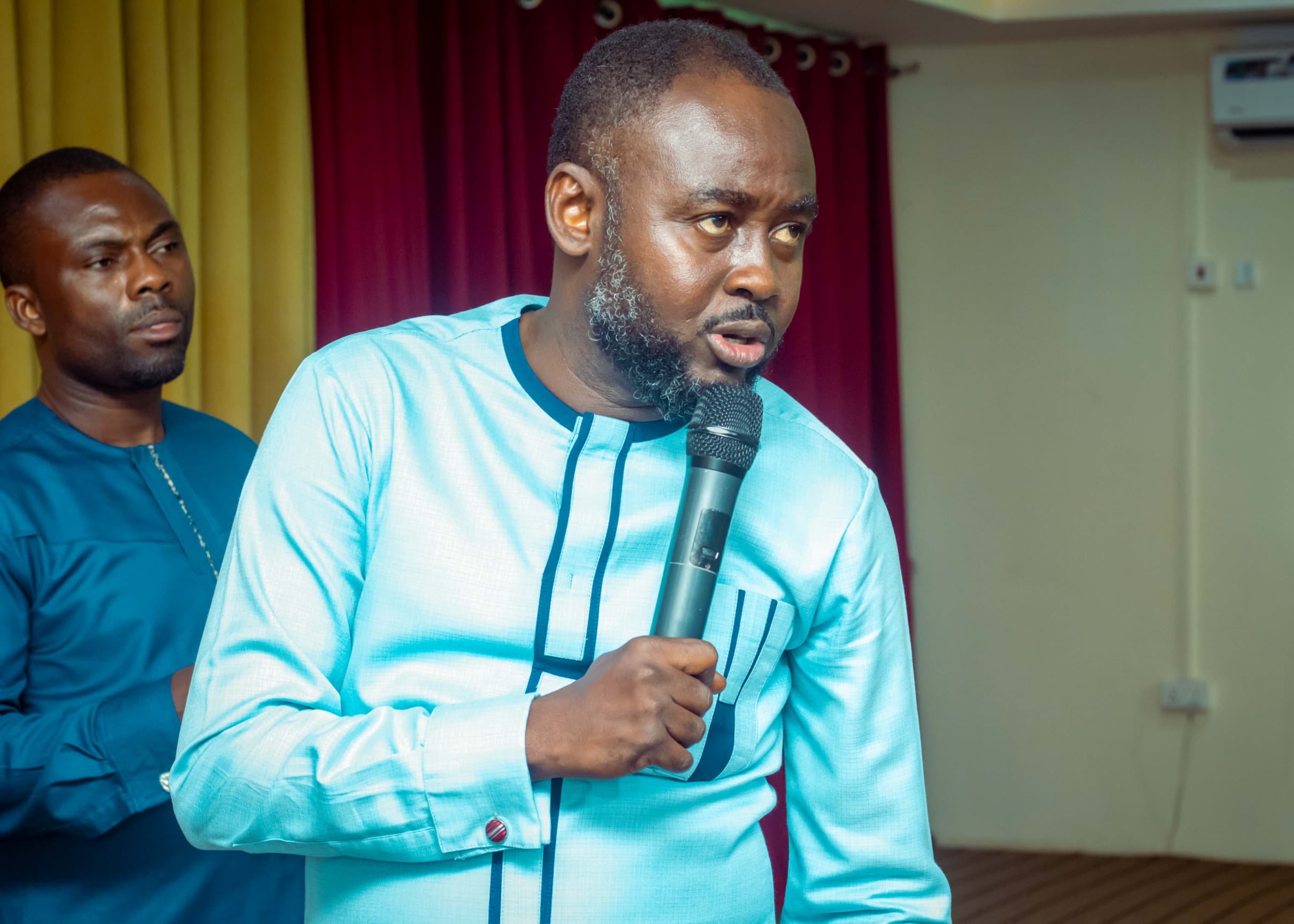 Guest speaker addressing the congregation at The God Realm Chapel