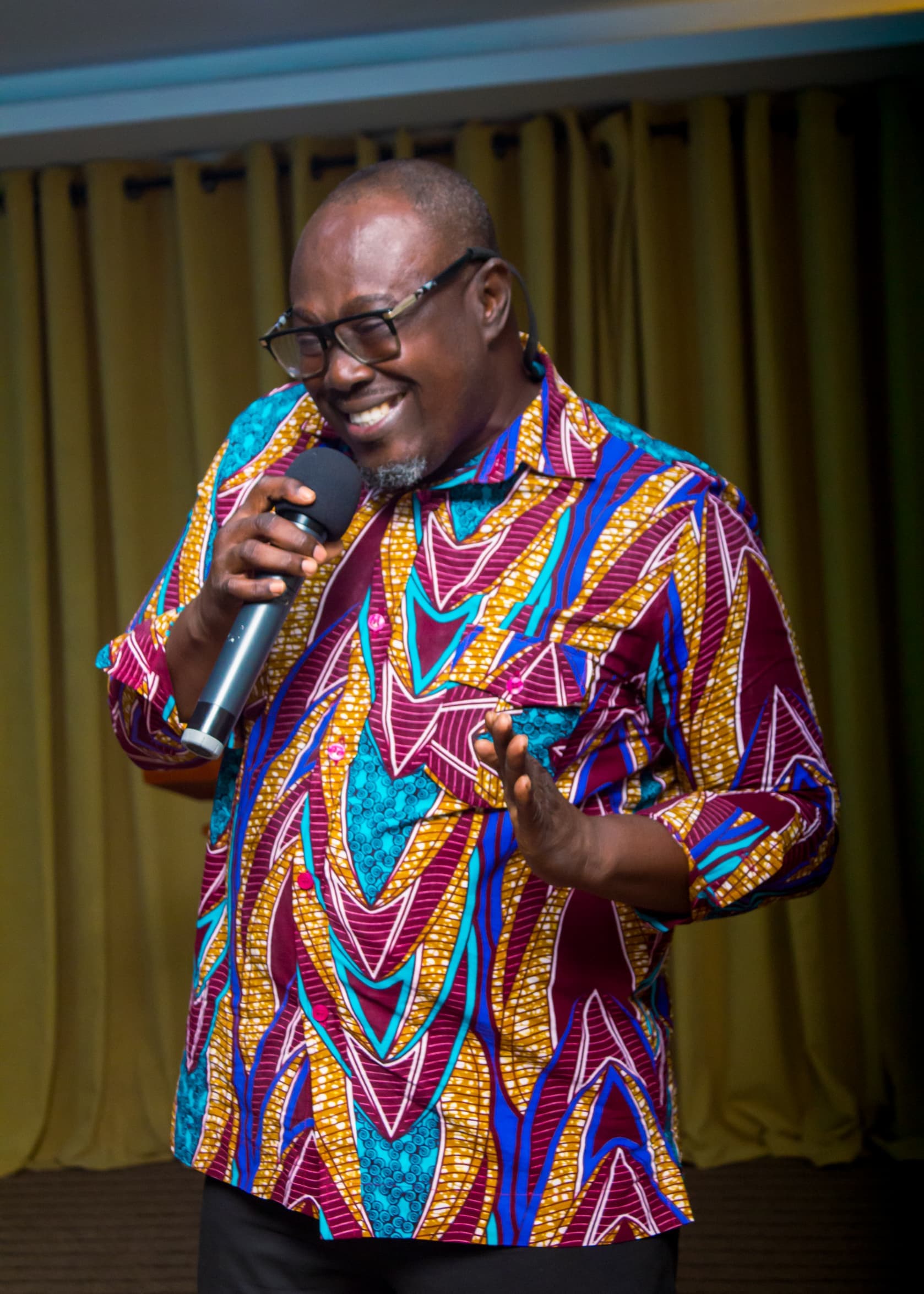Guest speaker smiling while sharing at a church event
